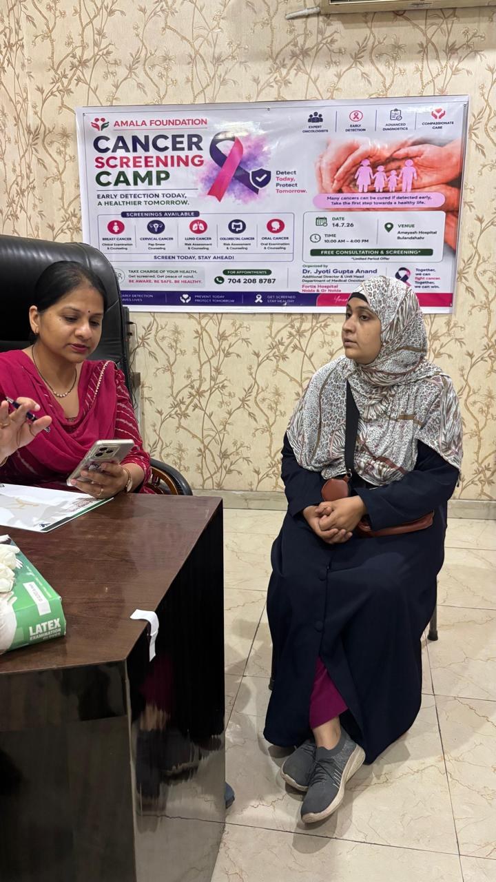 Doctor speaking with a patient at the screening camp